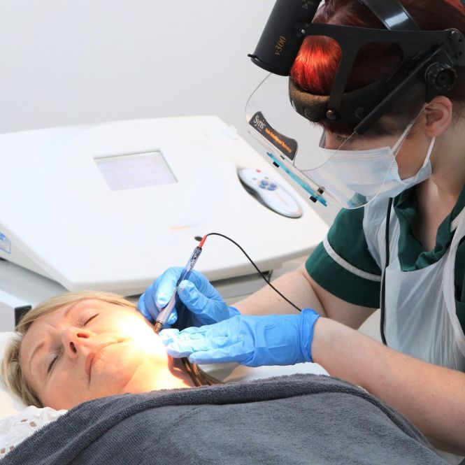 Nurse Anna Blackshaw treats a female patient at The Lomond Clinic