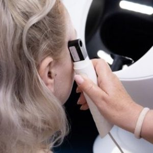 Eventis skin analysis TWL probe taking reading from a client's facial skin