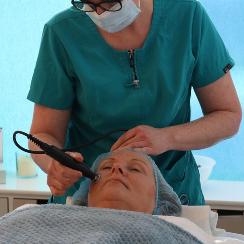 Client receiving a specialised facial treatment from Jill du Toit skincare expert at The Lomond Clinic, Helensburgh