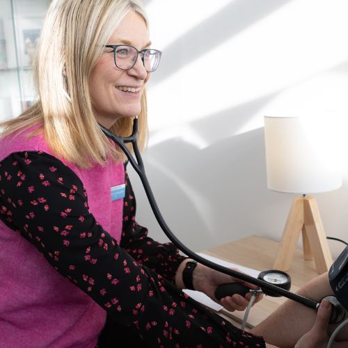 Dr Joyce Braaksma, private GP at The Lomond Clinic Helensburgh, taking a patient's blood pressure