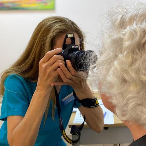 Iridologist Carolyn Aitken photographs a client's eyes for iridology assessment at The Lomond Clinic, Helensburgh